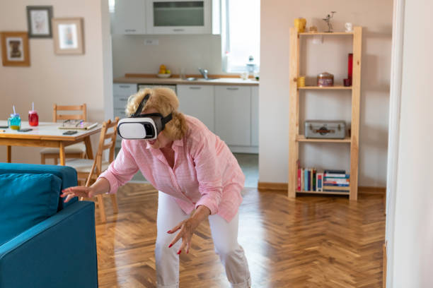 istock Senior woman having fun with virtual reality headset 1156294005