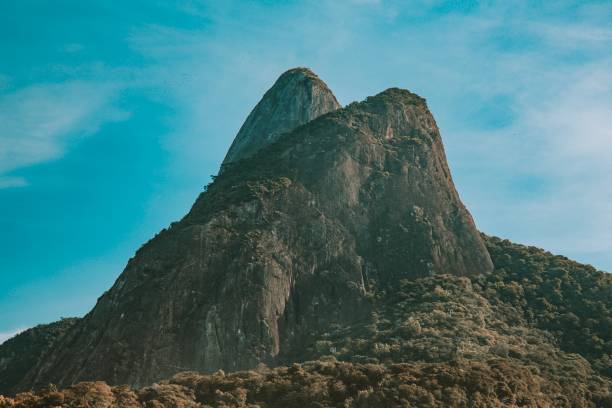 Two Brothers Mountain Two Brothers Mountain on Cliff Municipal Natural Park Dois Irmãos, Rio de Janeiro, Brazil two brothers mountain stock pictures, royalty-free photos & images