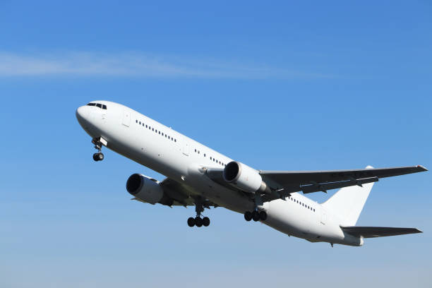 istock White airplane after take off 1156296369