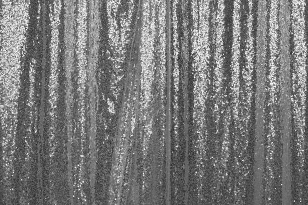 Sequin curtain. A silver curtain made from sequins for photo props background. stock photo