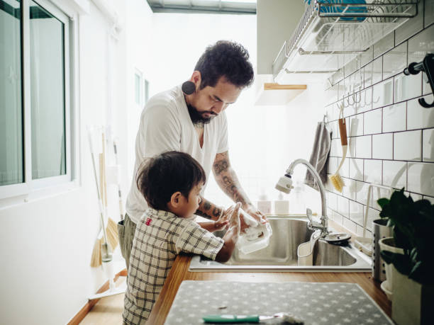 istock Asian Baby Boy Helping Father with the House Work 1156297359