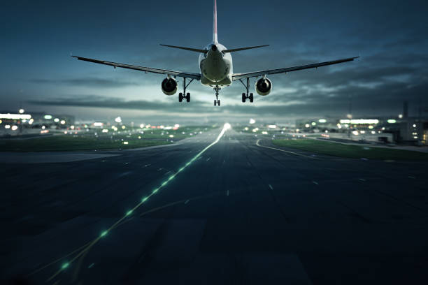 istock Airplane landing at night 1156297872
