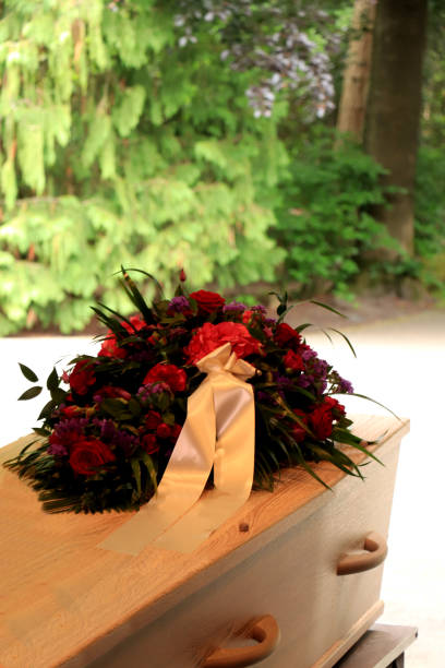 istock A coffin with a flower arrangement in a morgue 1156297973