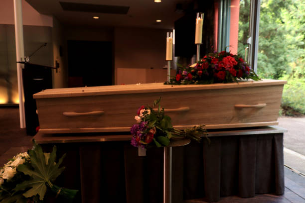 istock A coffin with a flower arrangement in a morgue 1156298002