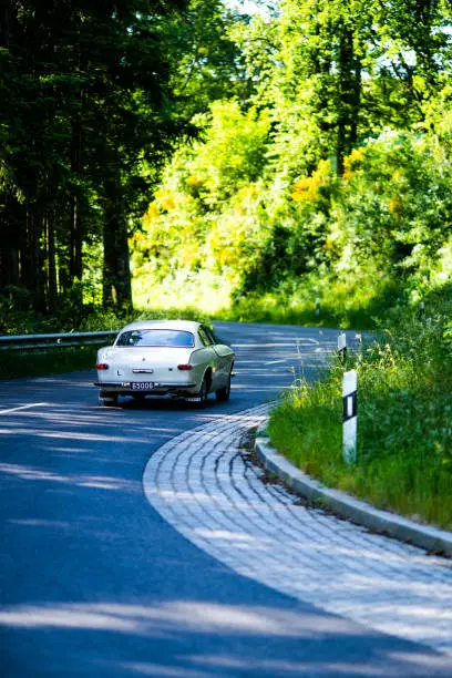 Classic car on road and nature