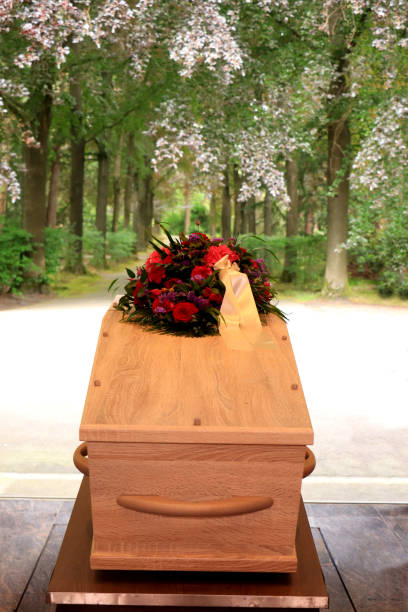 istock A coffin with a flower arrangement in a morgue 1156298041