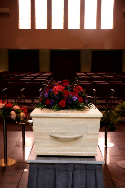 istock A coffin with a flower arrangement in a morgue 1156298076