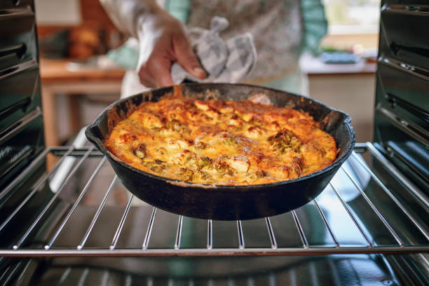 istock Preparing Frittata with Paprika, Spring Onions, Peas, Spinach and Parmesan 1156299036