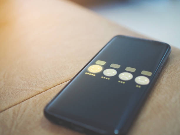 istock hand holding smartphone with customer service and smile face icon on screen 1156299510