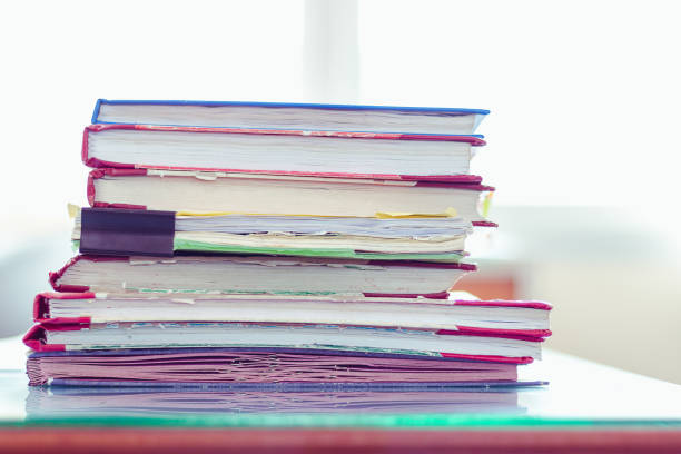 istock Stack of documents placed on a business desk in a business office. 1156300407