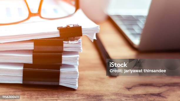 Stack Of Documents Placed On A Business Desk In A Business Office Stock Photo - Download Image Now