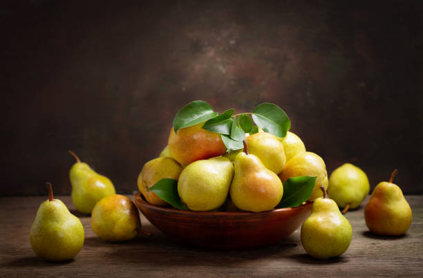 istock fresh ripe pears with leaves in a bowl 1156301406