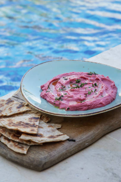 istock Beetroot hummus with pieces of freshly baked naan bread 1156301469