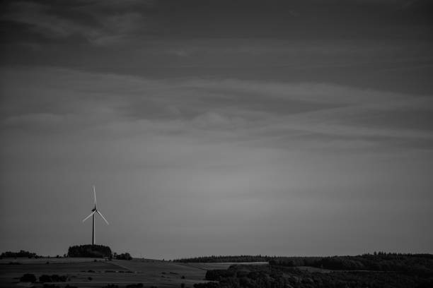 istock wind turbine in the white and black nature 1156301483