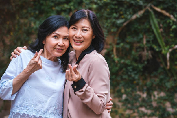 istock Happy women hugging with joy in cafe 1156301515