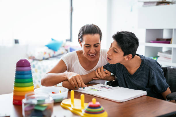 istock Children with disabilities learning better with parents. 1156301586