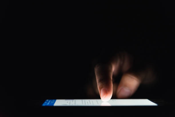 istock Female using smartphone on her bed in night time 1156301612