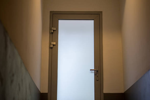 istock stairway leading to white door in apartment 1156301921