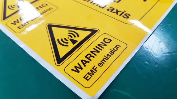 Warning EMF Symbol Sign,Radiation warning sign on the Hazardous materials transport label Class 7 at the aluminum container of transport truck