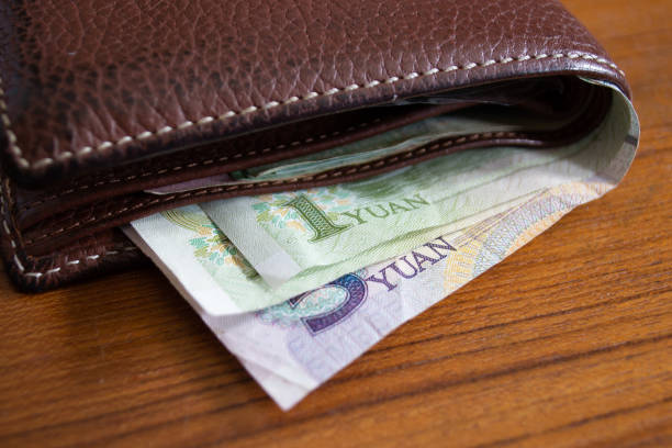 istock Chinese Yuan banknotes in wallet 1156303117