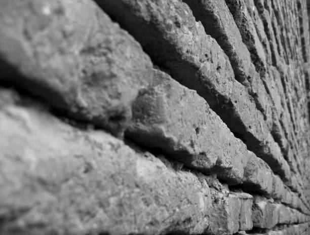 istock black white red brick wall texture. Horizontal view. closeup of aged brick wall. 1156304956