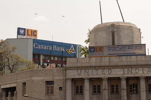 Bangalore, Karnataka India-June 04 2019 : LIC or life insurance corporation of India and Canara bank billboard on top the building at bengaluru,India.