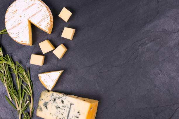 istock Cheese with mold with a sprig of thyme on a slate Board 1156308949