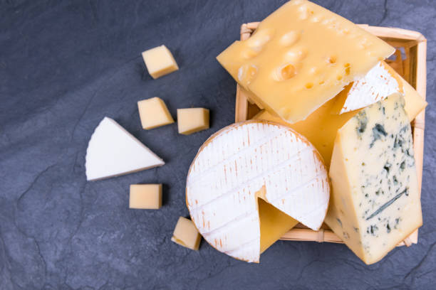 istock different cheeses on the slate Board close-up. copy space 1156308975