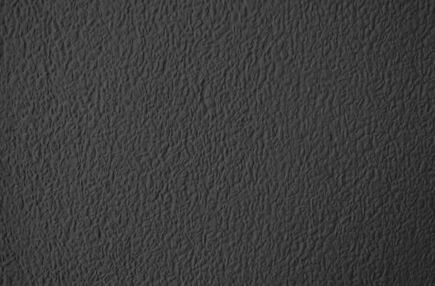 istock Texture of The Black Stucco Wall Background 1156311052