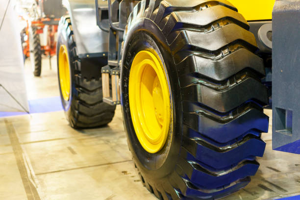 istock Close up of tractor tire, selective focus. Modern Tractor Close-Up 1156311182