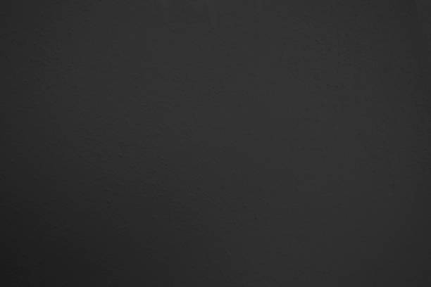 istock Texture of The Black Stucco Wall Background 1156311224