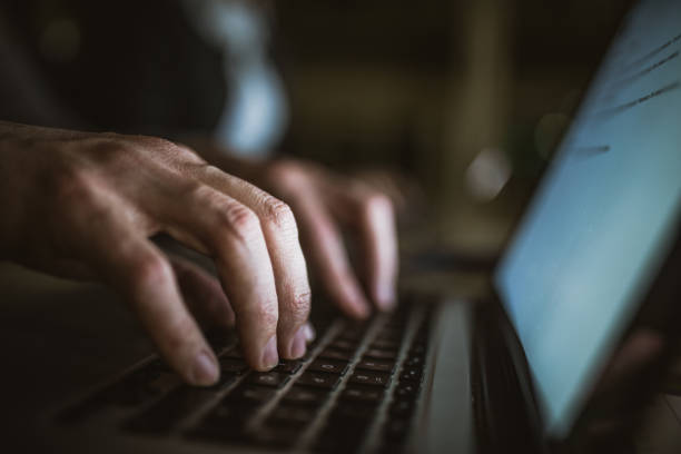 istock Close up of unrecognizable person typing an e-mail on laptop. 1156311544