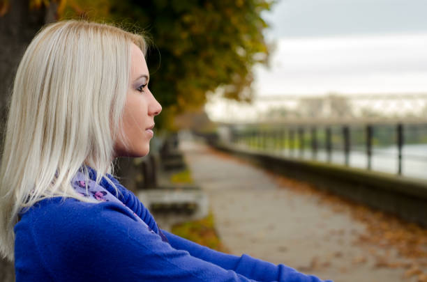 istock Woman in the autumn nature 1156314192