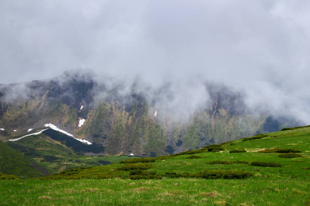 istock The mountain in the cloud and fog 1156315476