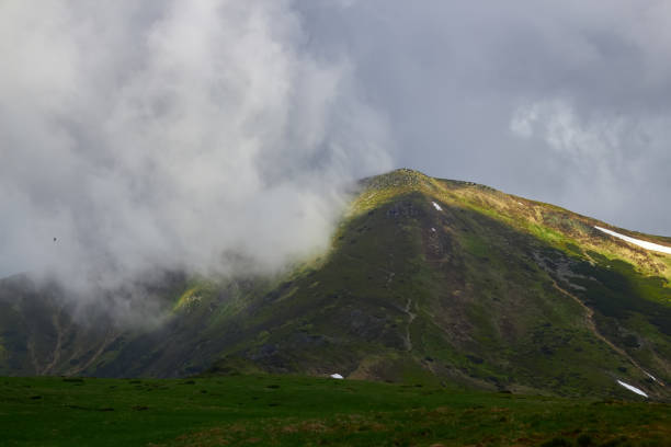 istock The mountain in the cloud and fog 1156315477