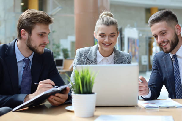 istock Group of business partners discussing ideas and planning work in office. 1156315934