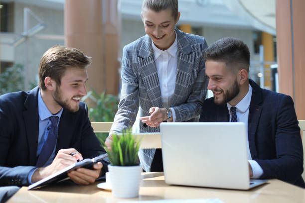 istock Group of business partners discussing ideas and planning work in office. 1156315944