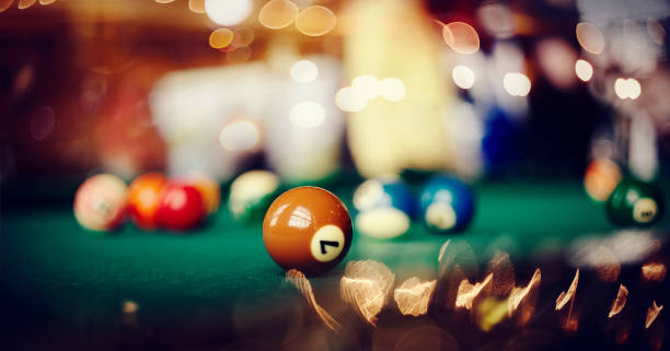 istock Billiard ball with number seven on a green billiard table. 1156316011