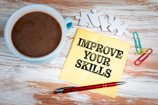 istock IMPROVE YOUR SKILLS concept. Text on a napkin 1156316770