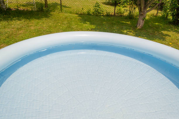 istock A round, blue, garden pool for children. 1156317079