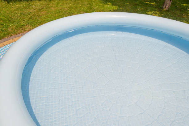 istock A round, blue, garden pool for children. 1156317155