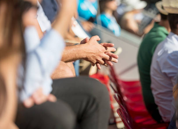 istock Anxious hands at sports event 1156317178