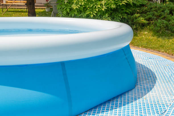 istock A round, blue, garden pool for children. 1156317183