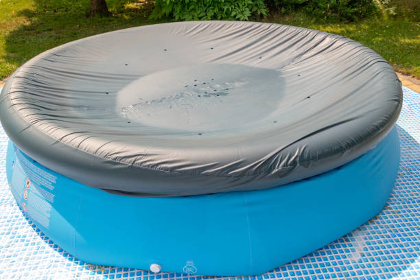 istock A round, blue, garden pool for children. 1156317192