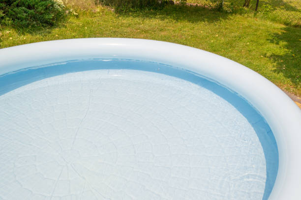 istock A round, blue, garden pool for children. 1156317228