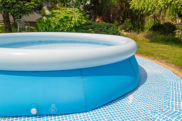 a round, blue, garden pool for children. - above ground pool imagens e fotografias de stock