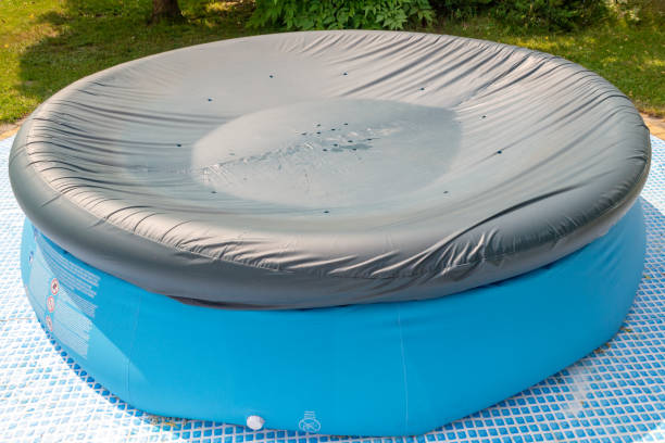 istock A round, blue, garden pool for children. 1156317278