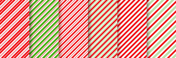 cukierki trzcinowe bez szwu wzór. wektor czerwony zielony ilustracji. - christmas pattern striped backgrounds stock illustrations