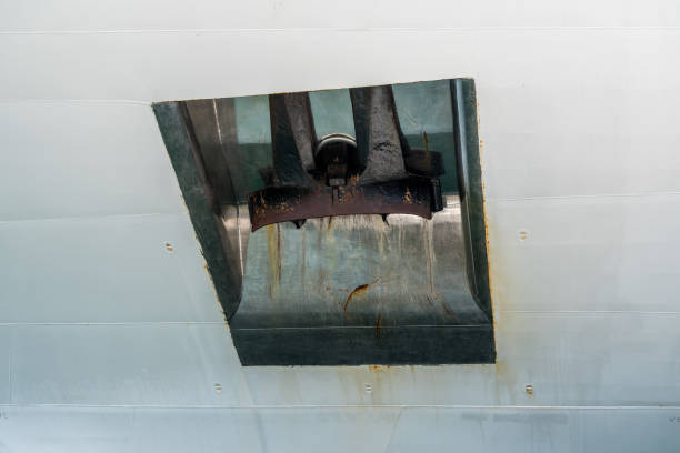 istock Heavy anchor on side of white cruise ship 1156318704