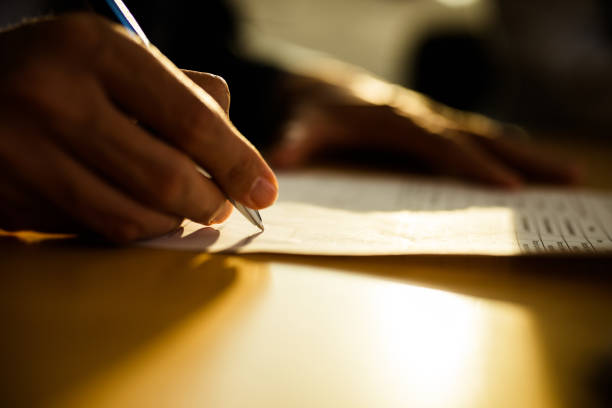 istock Close up of unrecognizable person signing a contract. 1156319717